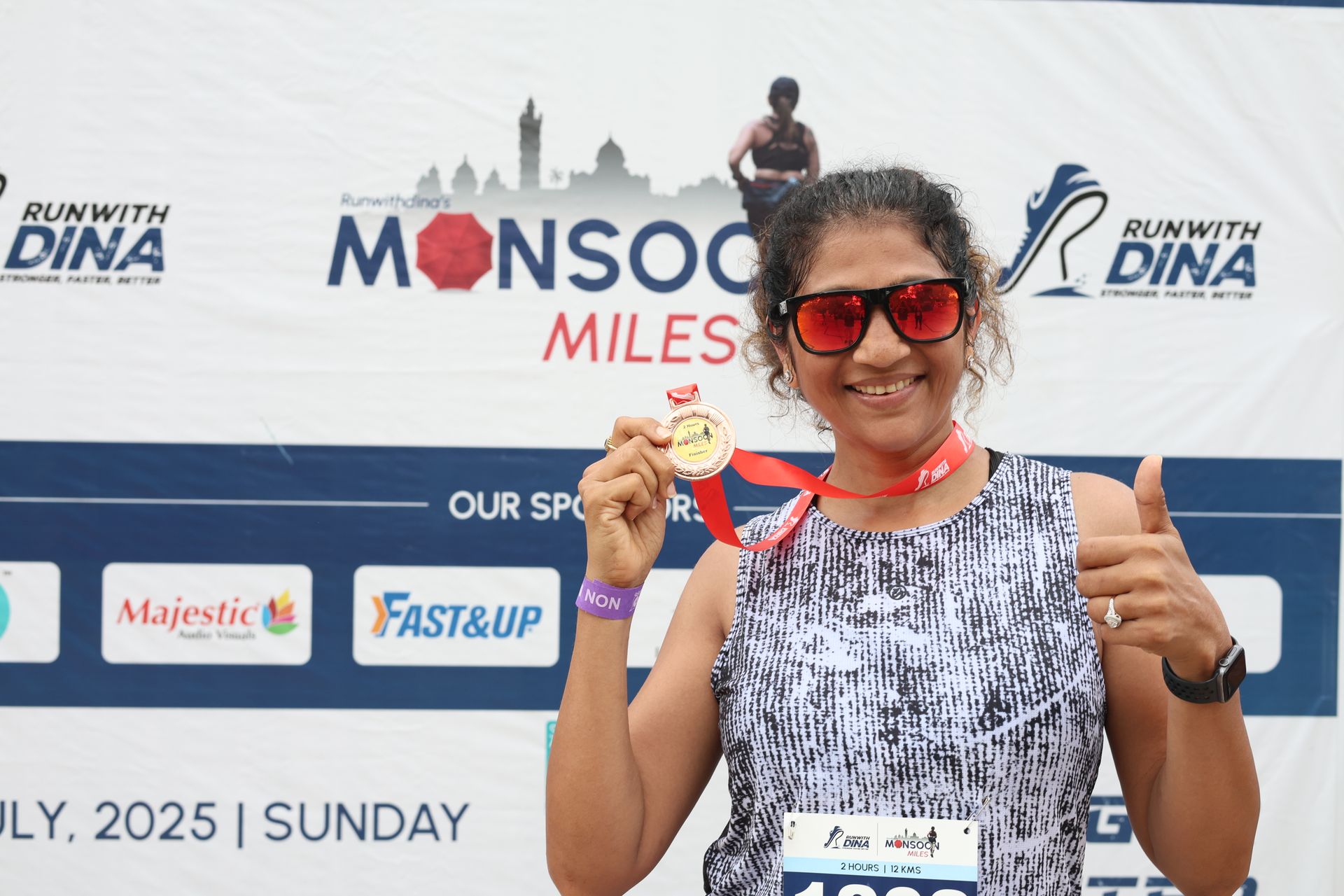 Proud finisher showing medal