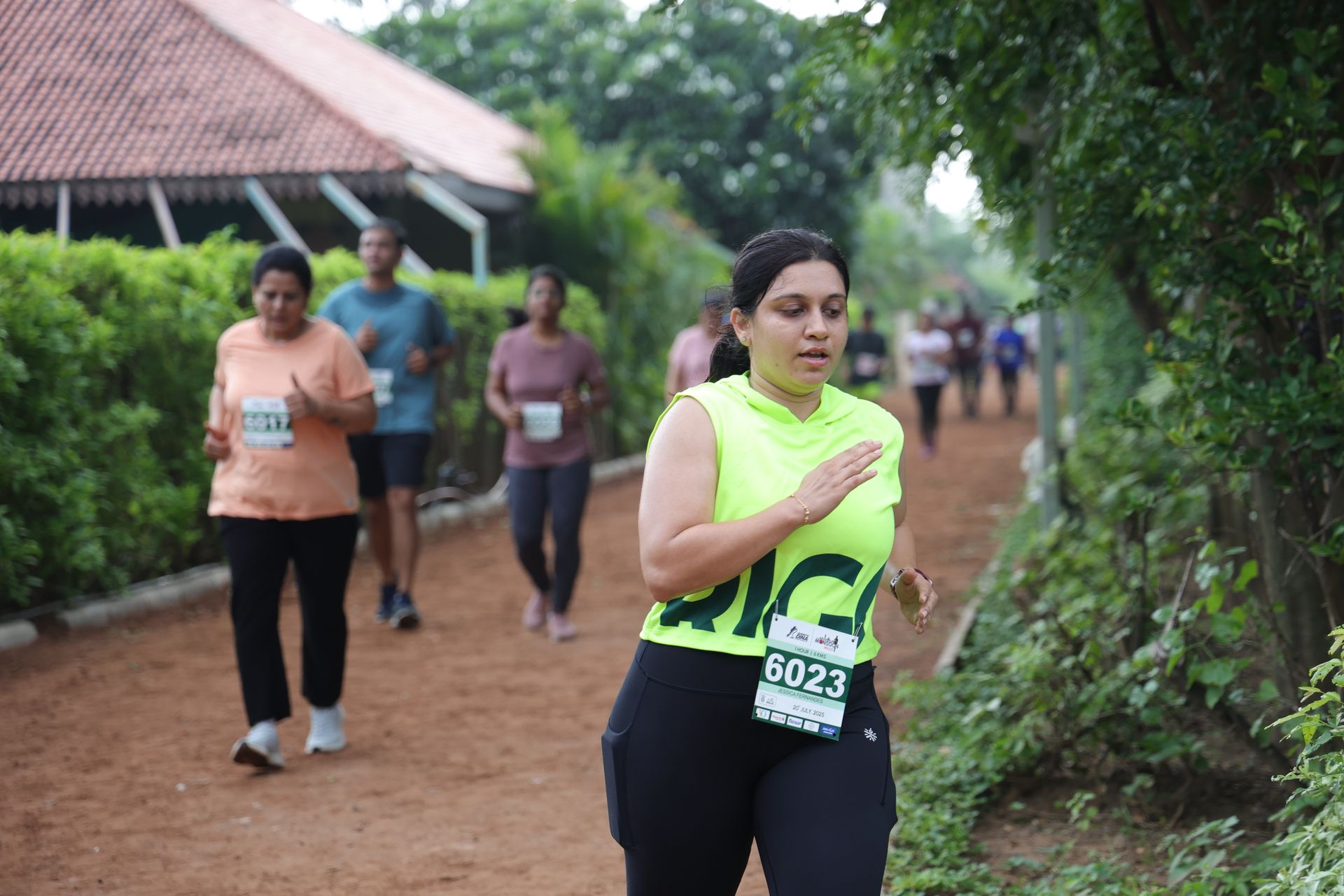 Runner in neon on trail