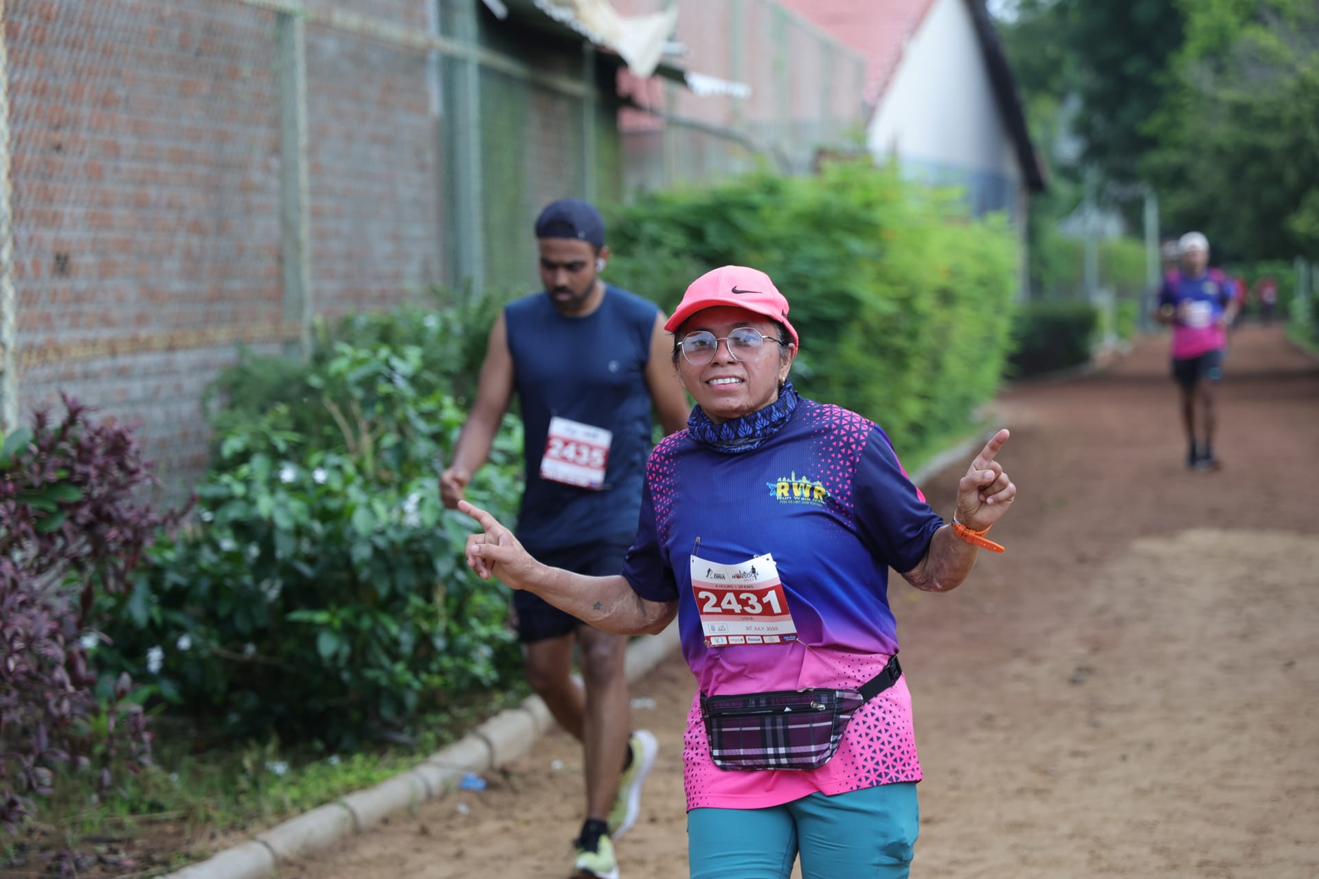 Runner posing on trail